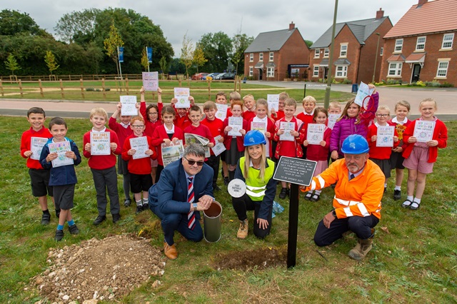 Neil Douglas, Reanna Lupton and Chris Liston burying the time capsule with the pupils